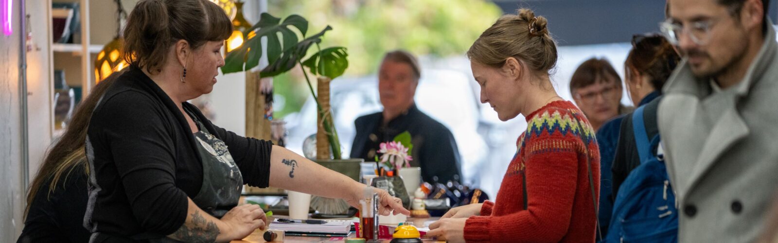 Ceramic artists at SPUN talk with visitors on the Tacoma Studio Tour.