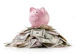 Piggy bank with dollars pile