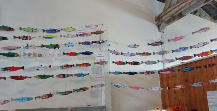 Paper salmon, created by students at Tacoma elementary schools, strung around Foss Waterway Seaport Museum.