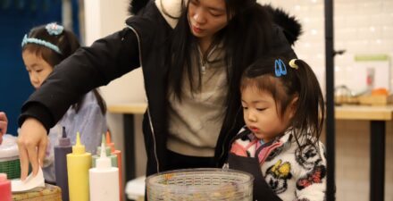 A family creates a spin-art painting in the art studio at Children's Museum of Tacoma.