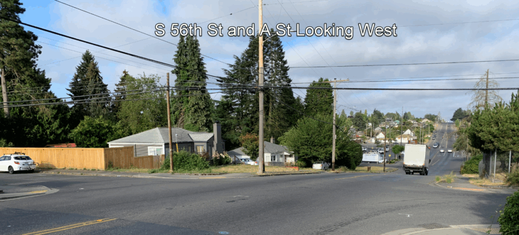 Photo taken from northeast corner of the intersection of 56th Street and A Street looking west. The intersection has no markings or signals, and hills limit pedestrians' views of oncoming traffic.