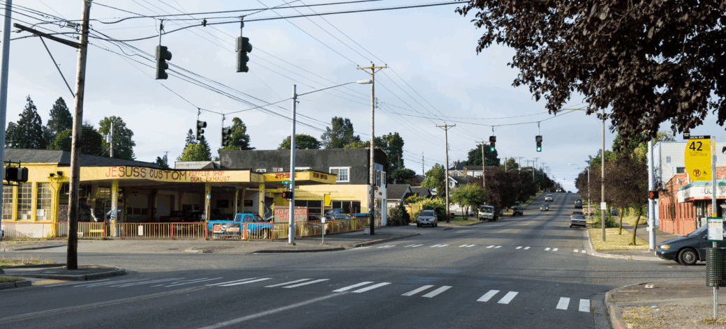 Street view photo of the McKinley and 40th intersection. Missing curb ramps and outdated signalization is visible.