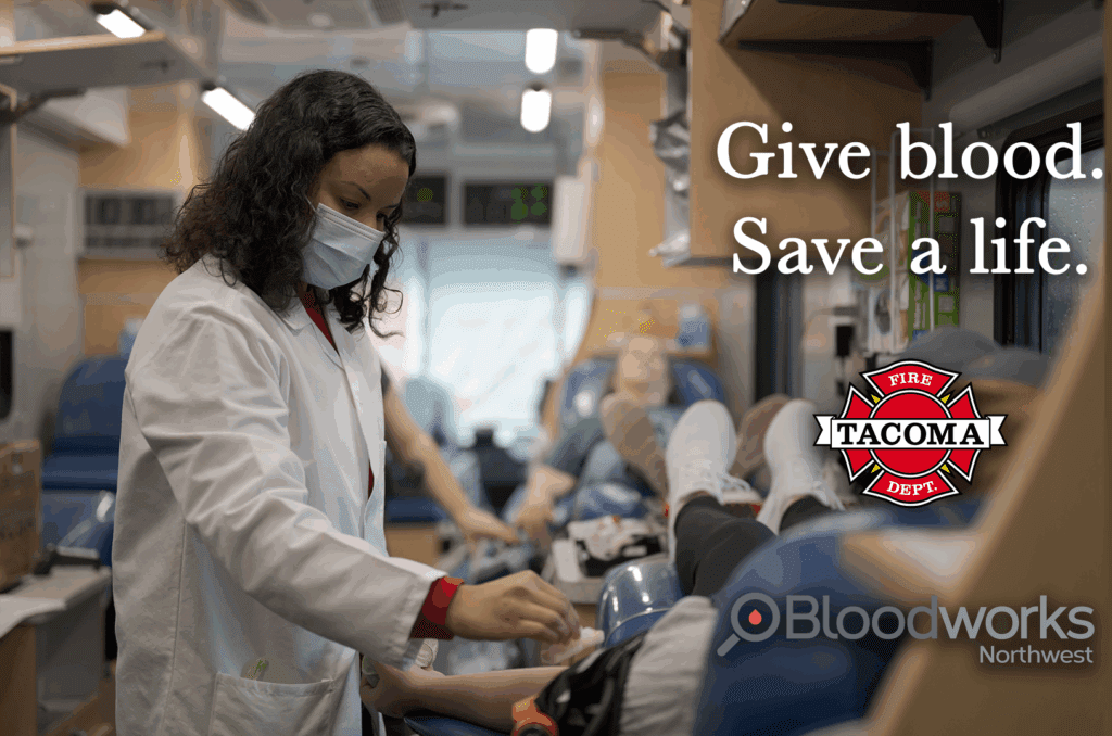 Person giving blood in a bloodmobile