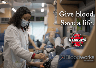 Person giving blood in a bloodmobile