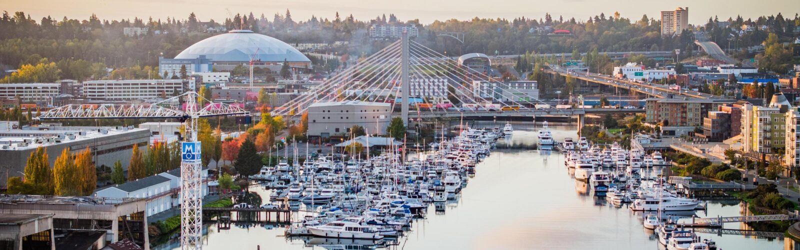 Photo of the sunrise in downtown Tacoma showing the Tacoma Dome and Commencement Bay