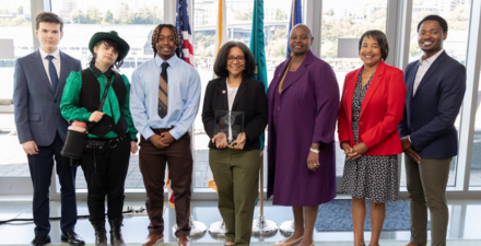 Group accepting an award. Strickland fellowship student group.