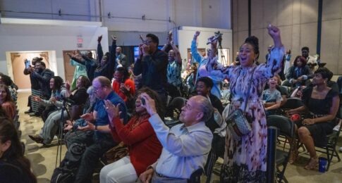 People cheering at the City of Destiny Awards