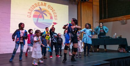 Dance performance with artist and young children at Caribbean Queens festival